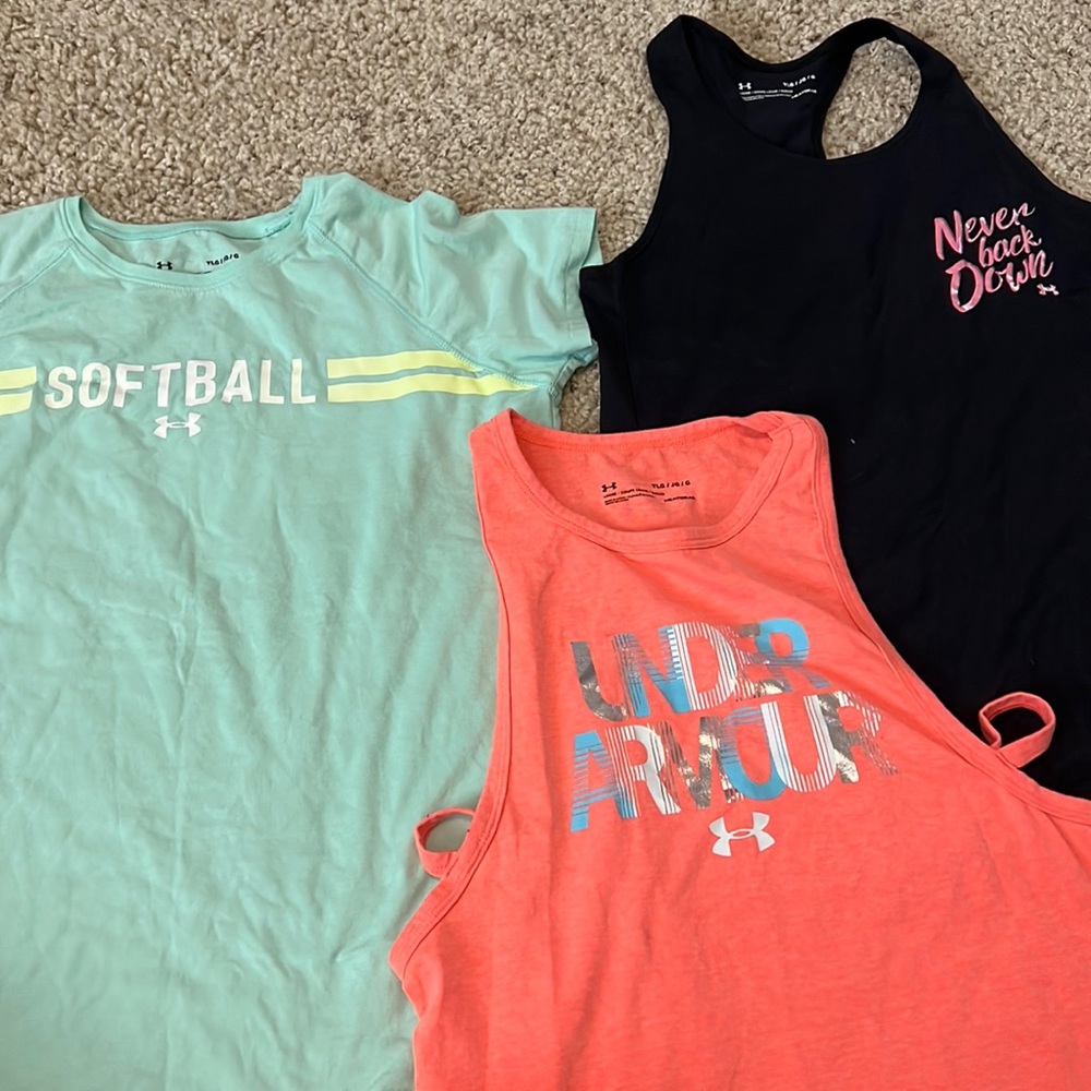 under armour shirts with sleeve and two tanks.like new. Only worn a couple times
